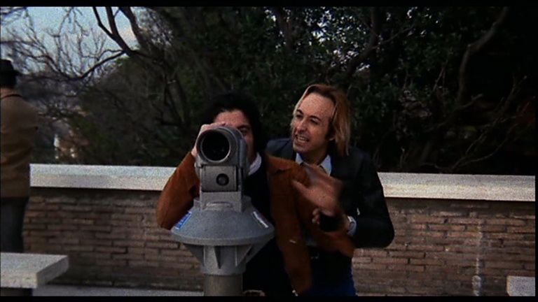 Passi di danza su una lama di rasoio (1973) Blonde man at telescope 1.jpg