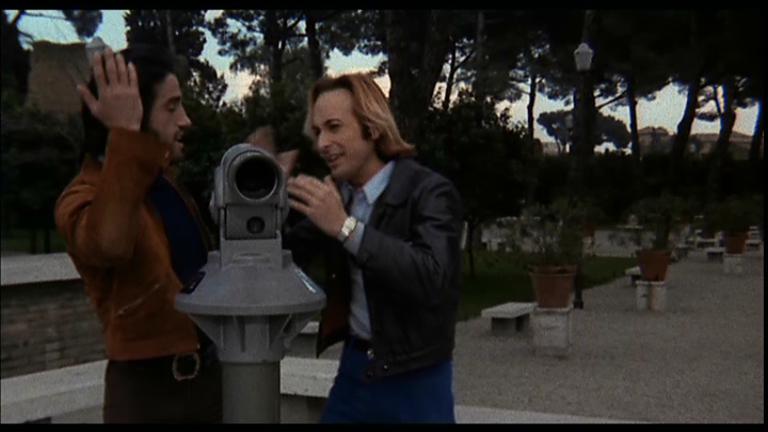 Passi di danza su una lama di rasoio (1973) Blonde man at telescope 3.JPG